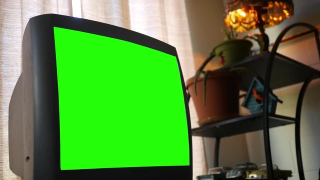 A large thick standard definition green screen generic Television in living room ALT