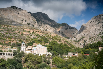 Fototapeta na wymiar Church and mountain landscape