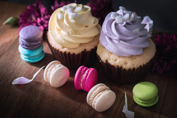 macarons or macaroons and cupcakes on wooden dessert sweet beautiful to eat