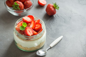Cheesecake with strawberries in jar
