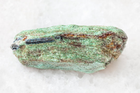 rough Paragonite stone on white