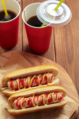 Hot dogs on wooden background