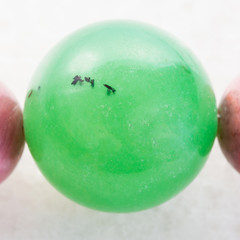 bead from green Aventurine gemstone on white