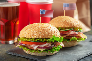 Fast food, homemade burger on a wooden background
