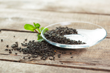Dry tea on wooden table background