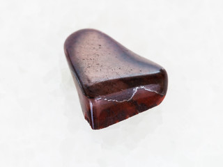 polished jaspilite jasper gemstone on white marble