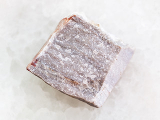 raw Rhyolite stone on white marble