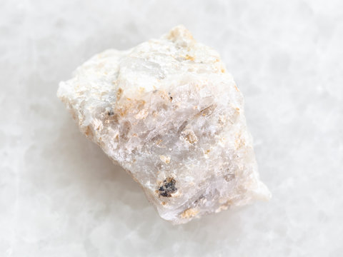 Raw Conglomerate Stone On White Marble