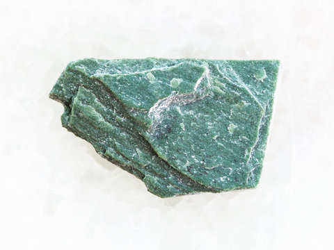rough Phyllite stone on white marble