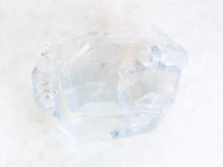 rough crystal of celestine stone on white marble
