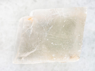 rough crystal of Iceland spar gemstone on white