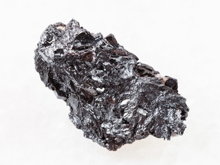 piece of hematite ore on white marble