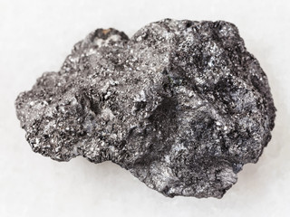 raw Graphite stone on white marble