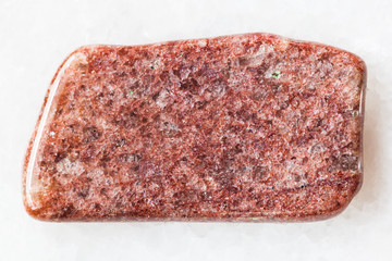 polished slab of aventurine gemstone on white