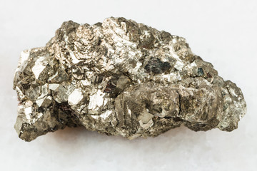 raw marcasite stone (white iron pyrite) on white
