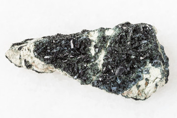 crystal of hornblende on amphibole-carbonate rock
