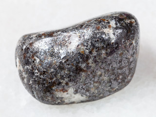 pebble of magnetite stone on white