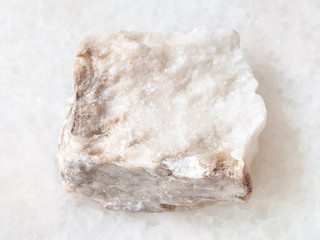 rough Anhydrite stone on white