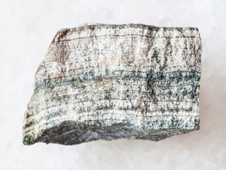 piece of raw skarn stone on white