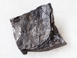 rough carbonaceous shale stone on white