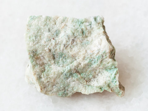 rough Listwanite stone on white