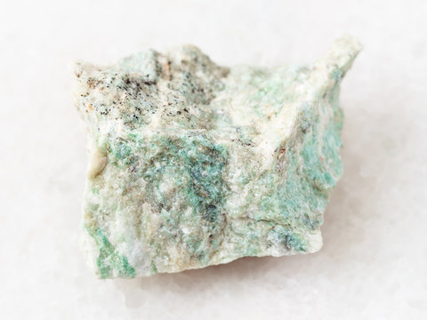 piece of rough Listwanite stone on white