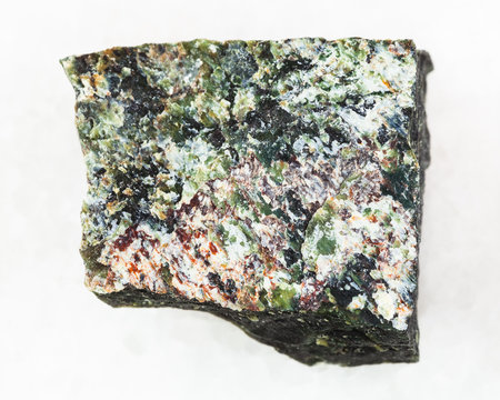rough dunite stone on white