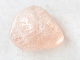 polished morganite (pink beryl) gemstone on white