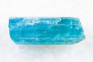 crystal of aquamarine (blue beryl) on white