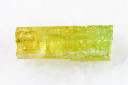 raw crystal of Heliodor (yellow beryl) on white
