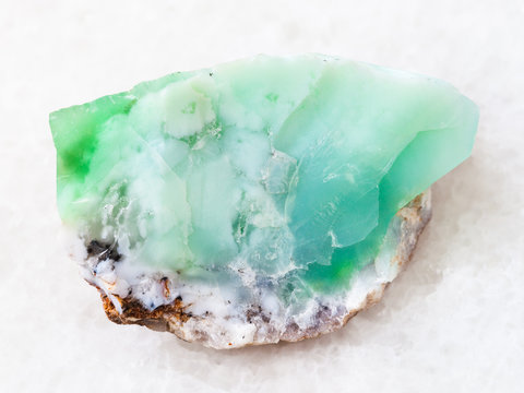 raw crystal of Chrysoprase gemstone on white