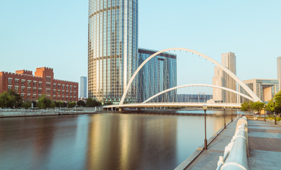 Naklejka premium Tianjin city waterfront downtown skyline with Haihe river,China.