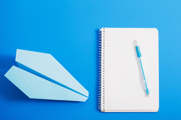 paper plane on blue color background