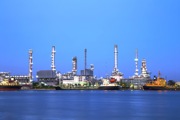 Oil and Gas Refinery plant industry factory with river on twilight time
