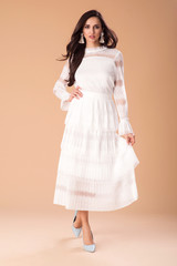 Beautiful fashionable woman well dressed, handbag and accessories. Fashion spring summer photo. Lace dress