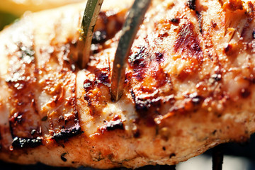 Grilled chicken breast on barbeque