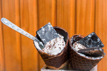 Ice cream in a horn with chocolate