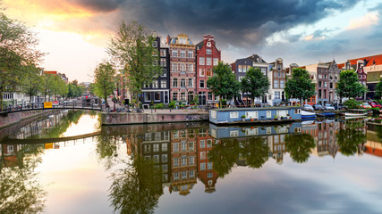 Traditional Dutch old houses on canals in Amsterdam, Netherland.