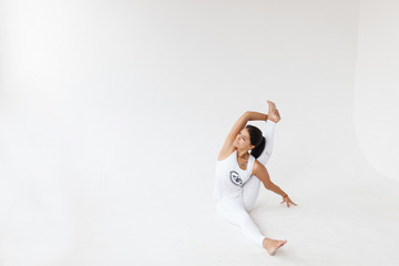Beautiful young woman doing yoga