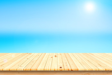  wooden table top on blurred beach background for product display.