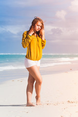 Teenage girl posing on the beach