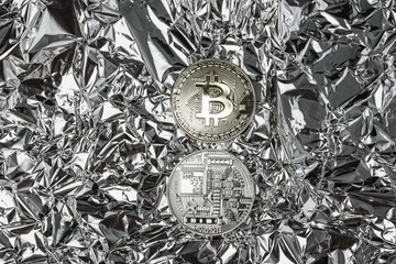 Coin Bitcoin isolated on a silver background. Silver and Golden coins from both sides. Virtual currency. Crypto currency. New virtual money.