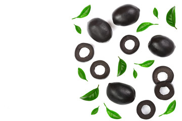 whole and sliced black olives decorated with leaves isolated on white background. Top view. Flat lay pattern