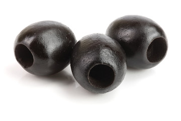 whole black olives isolated on white background macro