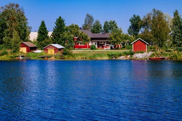 Foto op Plexiglas Aerial view of bridge across blue lake in summer landscape in  Finland © nblxer