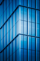 full frame of modern glass building,blue toned.