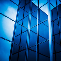 full frame of modern glass building,blue toned.