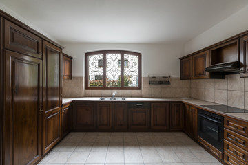 Elegant dark wood kitchen with window