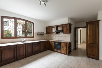 Elegant dark wood kitchen with window