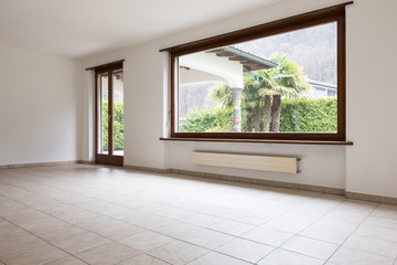 Fototapeta premium Empty large room with large windows.